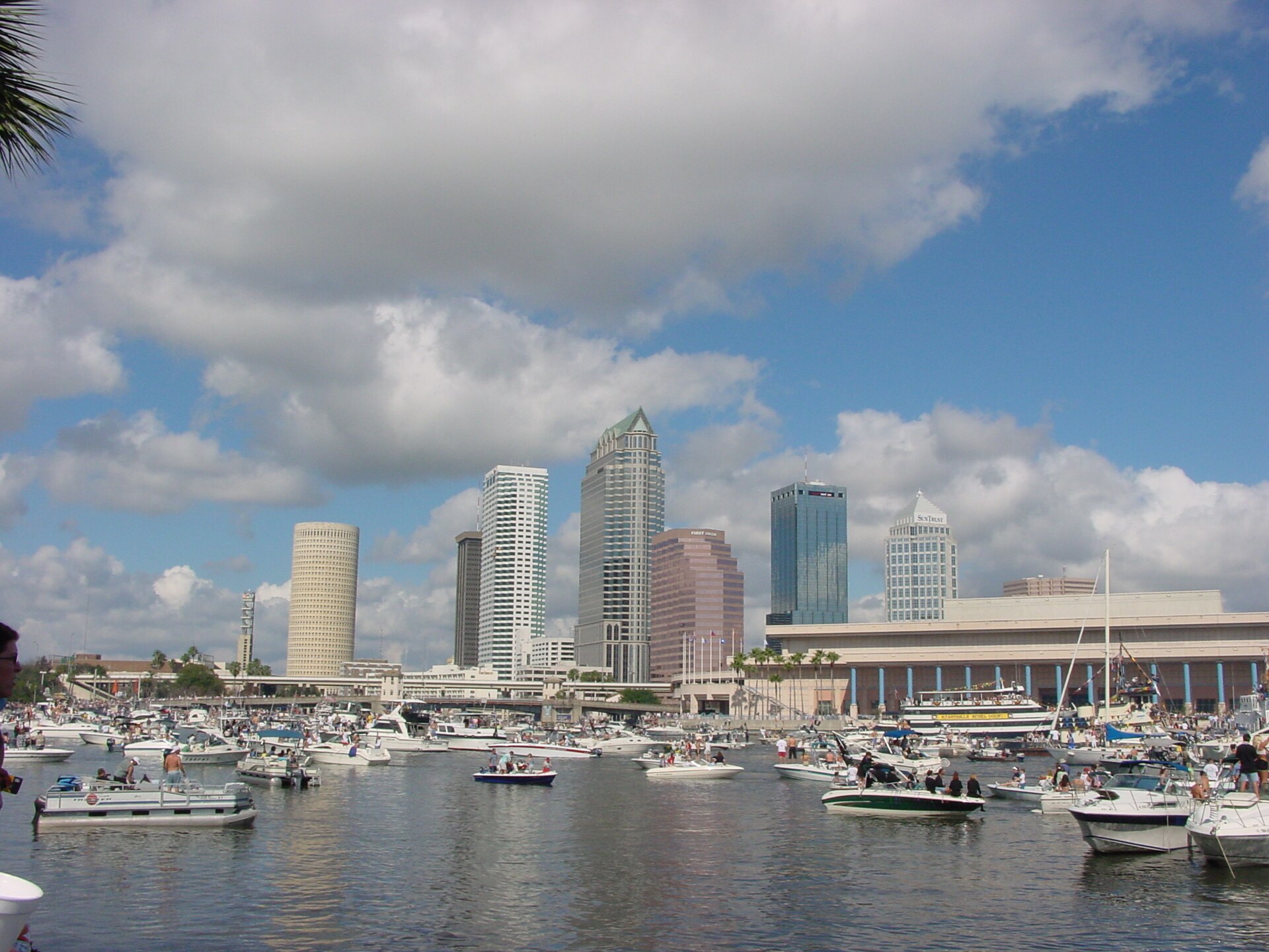 Boats gathered on the water in front of the downtown Tampa skyline during the Gasparilla Pirate Fest