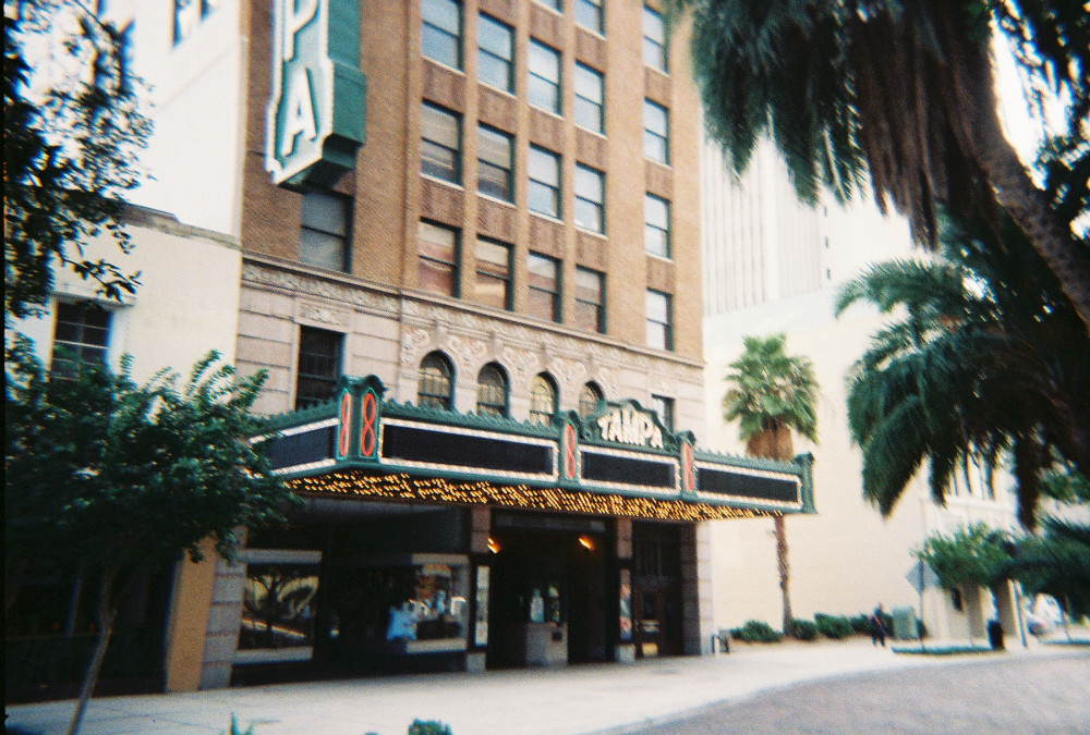 The green marquee and brick facade of the 1926 Tampa Theatre on North Franklin Street in downtown Tampa
